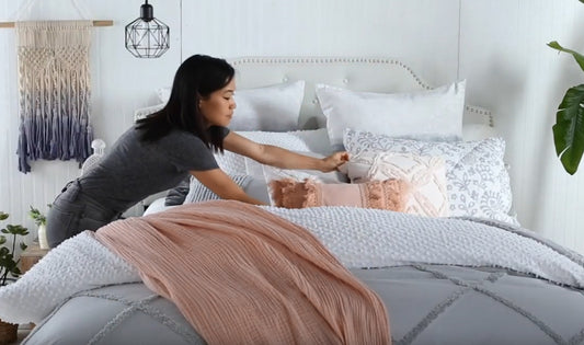 woman making a bed